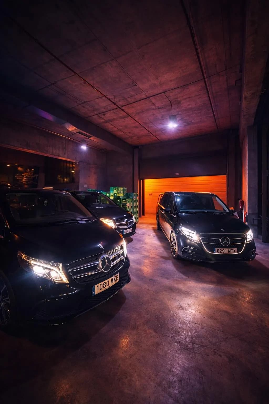AurelTransfers fleet of black Mercedes V-Class vans in the garage
